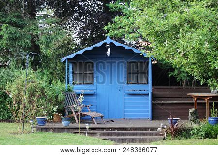 Blue Summer House In A South Facing Garden