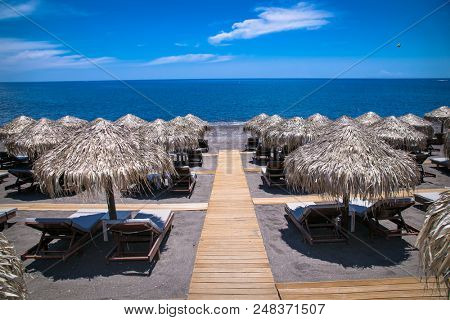 Permissa black sand beach in Santorini. Greece. 