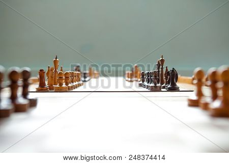 Wooden Chess Board With Wooden Chess Pieces.