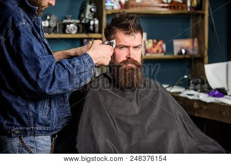 Barber With Clipper Trimming Hair On Temple Of Client. Hipster Lifestyle Concept. Barber With Hair C