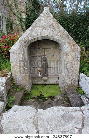 Fountain Near Saint Tugen Chapel In Primelin