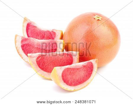 Ripe Grapefruit With Its Fragrant Red Slices Is Situated On The White Background.