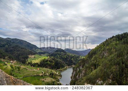 Zaovine Valley And Lake Seen From The Top Of A Cliff, With Some Mountain Village Houses Seen, Surrou