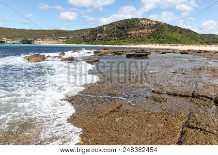 Wave Rolls Across The Rocks At Flat Rock South Of Moonee - Catherine Hill Bay On The New South Wales