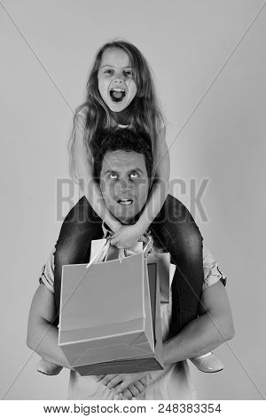 Daughter And Father With Pink Packages. Shopping, Presents And Family Concept. Girl And Man With Mad