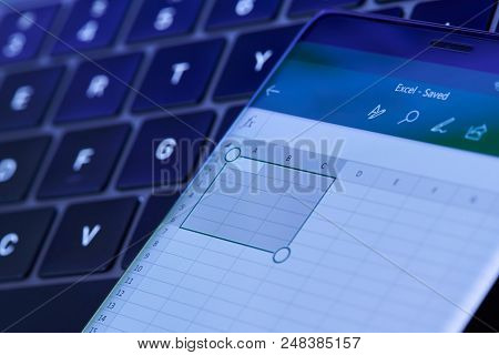 New York, Usa - July 6, 2018: Microsoft Excel Menu On Smartphone Screen Lay On Laptop Keyboard
