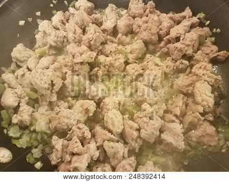 Seasoned Ground Turkey Meat Sizzing In A Frying Pan With Green Peppers