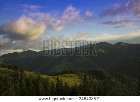 Photo Of Mountain Landscape In The Summer Under Beautiful Cloudy Sky. Ukraine, Carpathians, Dzembron