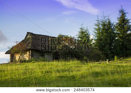Photo Of Mountain Village In The Summer Under Beautiful Cloudy Sky. Ukraine, Carpathians, Dzembronia