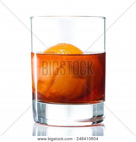 Alcohol Cocktail Negroni With Orange Ice Ball And Whiskey, Close-up, Isolated On White Background