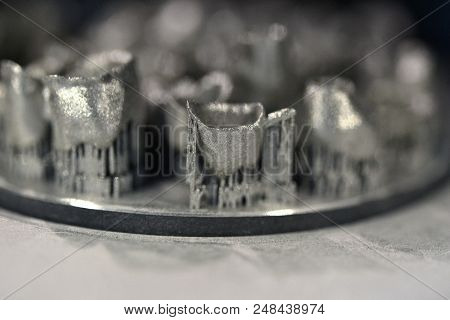 Object Printed On Metal 3d Printer, Laser Sintering Machine For Metal Close-up. A Metal Object Sprin