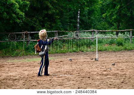 Cavalryman Shoot Standing In The Sand, Forest In The Background