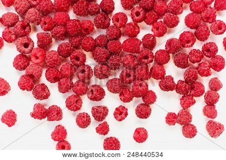Dripping Raspberry On White Background. Close-up Photo.