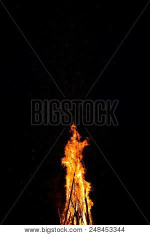 Midsummer Night. Young People In Slavic Clothes Sitting Near The Bonfire.