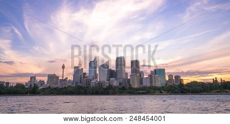Sydney Harbour Cityscape At Dusk With Colourful Sunset Sky And Clouds, The Most Busiest Attractive C
