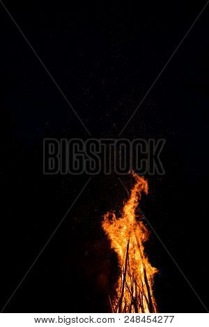 Midsummer Night. Young People In Slavic Clothes Sitting Near The Bonfire.