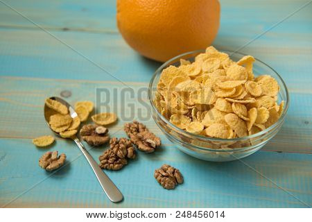 Healthy Corn Flakes With Milk For Breakfast With Fruit. Tasty Cornflakes Witt Walnut In Glass Bowl O