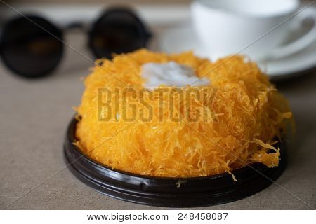 Close Up Selective Focus Piece Of  Gold Egg Yolk Thread Cake , Or   Cake Foi Tong Thai Pandan Cake  