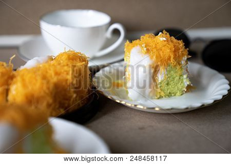 Close Up Selective Focus Piece Of  Gold Egg Yolk Thread Cake , Or   Cake Foi Tong Thai Pandan Cake  