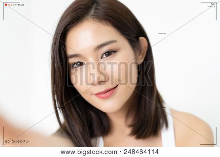 Beautiful Asian Girl Make Selfie Recording Video Vlog From Hands With Mirrorless Camera. Camera Scre