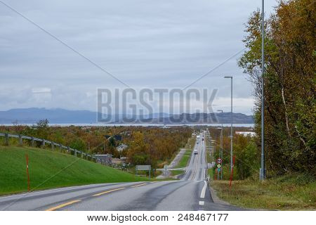 Lakselv Norway, City Seen From A Hill With Mountains On The Other Side Of Water On An Autumn Day