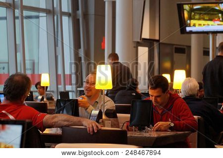 Toronto, Canada - 2014-11-24: People Having Rest Before The Flight In The Cafe In Toronto Pearson Ai