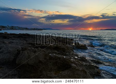 Beautiful Mysterious Marine Landscape At Sunset. Volcanic Reef And Ocean, Greek Iseland Crete