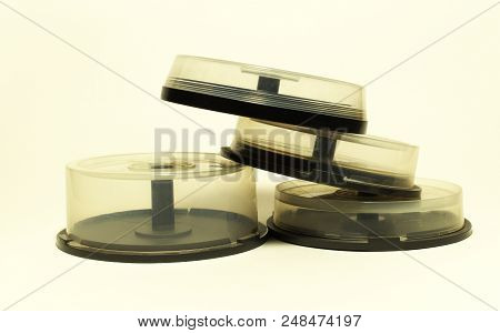 Storages With Spindel For Compact Disc. Small Capasity Boxes With Transparent Covers In Pile