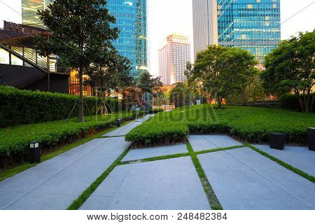 Empty Marble Road Surface With City Buildings Of Night