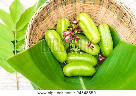 Averrhoa Bilimbi Fruit With Flowers On Banana Leaf