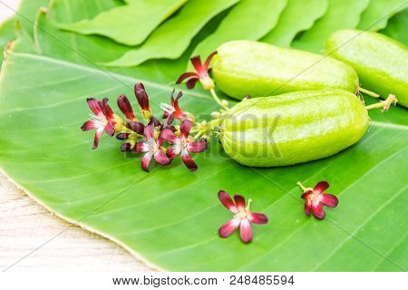 Averrhoa Bilimbi Fruit With Flowers On Banana Leaf