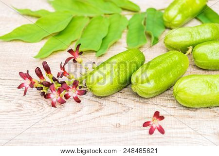 Averrhoa Bilimbi Fruit With Flowers And Leaf On Wood Background