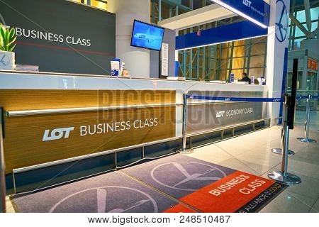 WARSAW, POLAND -  NOVEMBER, 2017: LOT Business class check-in counter in Warsaw Chopin Airport.