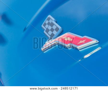 Corvette Brand Logo On Blue Convertible Manufactured By Chevrolet