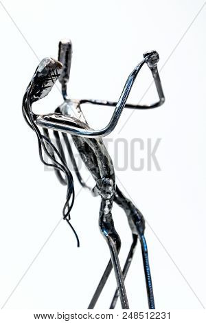 Figures Of Performers Made With Welded Black Metal Wire. Dancers Are Dancing Stylish With Sexy Passi
