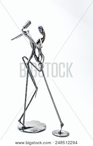 Figures Of Performers Made With Welded Black Metal Wire. Dancers Are Dancing Stylish With Sexy Passi