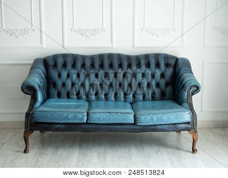 Beautiful Antique Blue Sofa On A Light Background.