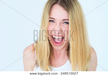 Face Of Enraged Infuriated Screaming Woman. Female Ready To Blow Up With Emotion. Young Beautiful Bl
