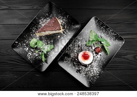 Photo Of Italian Panna Cotta Dessert With Strawberry Sirup And Cake With Nuts And Chocolate On The B