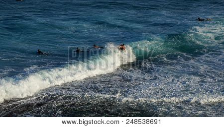 Australian Young Man And Lady Surfing At Tamarama Beach In Sydney, As Surfing Sport Is One Of Popula