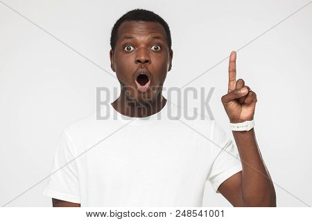 I Have An Idea! Handsome Afrcian American Man Keeping Finger Pointed Upwards, Showing Something Abov