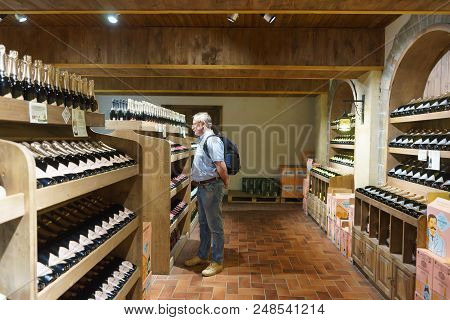 Tourist In The Company Store Grotto Of The Factory Of Sparkling Wines Abrau-durso Looks At The Showc