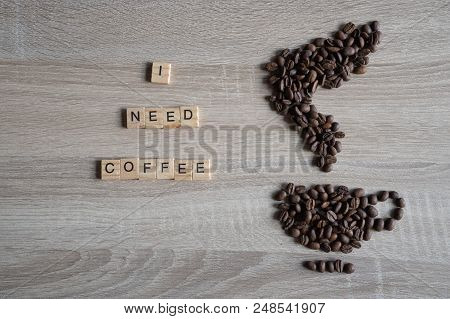 I Need Coffee Word Qoute With Roasted Coffee Beans Placed In The Shape Of A Cup And Smoke Icon On Wo