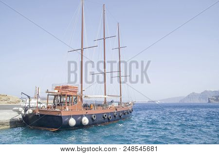 Wooden Ship For Trip In Port  On Santorini Island, Greece
