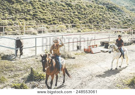 Couple Riding Horses Starting From Ranch For Excursion Day - Happy People Having Fun On Summer Time 