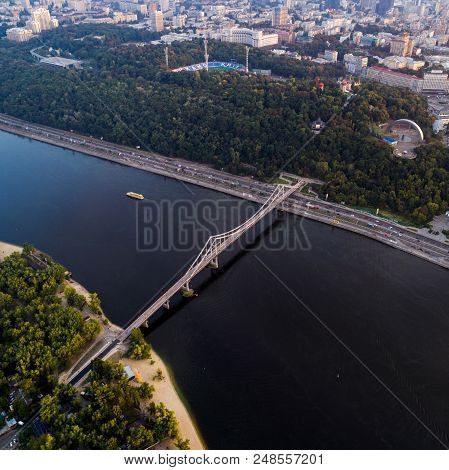 Panoramic View Of A Modern City With A River. Skyline Bird Eye Aerial View Of The Old Part Of The Ci