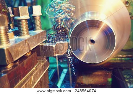 Shavings On The Details Close-up. Lathe, Metal Processing By Cutting On Industrial Equipment. Tinted