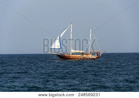 Monopoli, Italy - July 5 2018: Ship Yasemin Sultan From Mahagony Tree Sailing Near Beach Porta Vecch