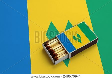 Saint Vincent And The Grenadines Flag  Is Shown In An Open Matchbox, Which Is Filled With Matches An