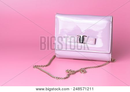 Female Lady Clatch Bag On Pink Background